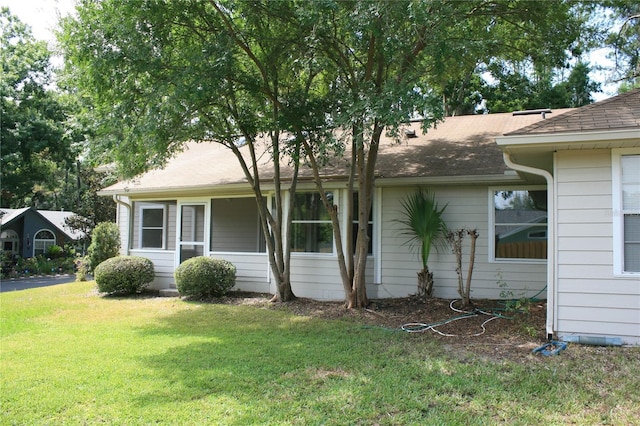 7518 NW 35th Pl, Gainesville, FL 32606 - view of front of house featuring a front lawn and a shingled roof