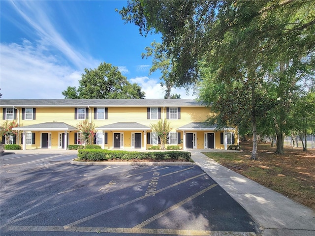 2951 SW 35th Pl Unit 148, Gainesville, FL 32608 - townhome / multi-family property featuring uncovered parking and a porch