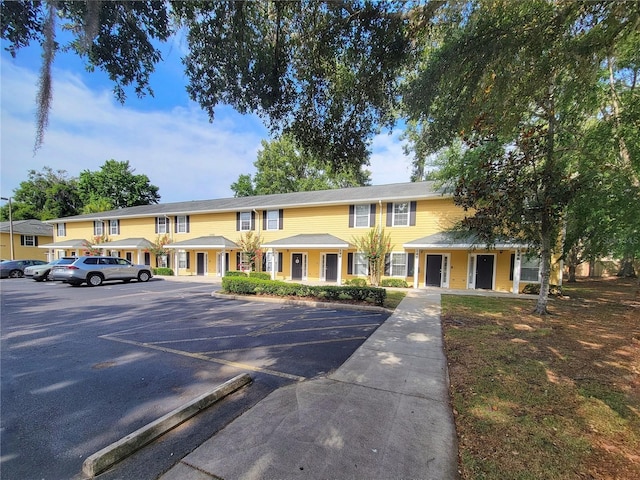 2951 SW 35th Pl Unit 148, Gainesville, FL 32608 - view of property featuring uncovered parking and covered porch