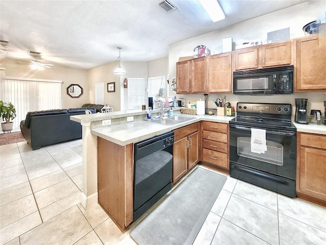 2951 SW 35th Pl Unit 148, Gainesville, FL 32608 - kitchen with black appliances, a peninsula, light countertops, light tile patterned flooring, and open floor plan