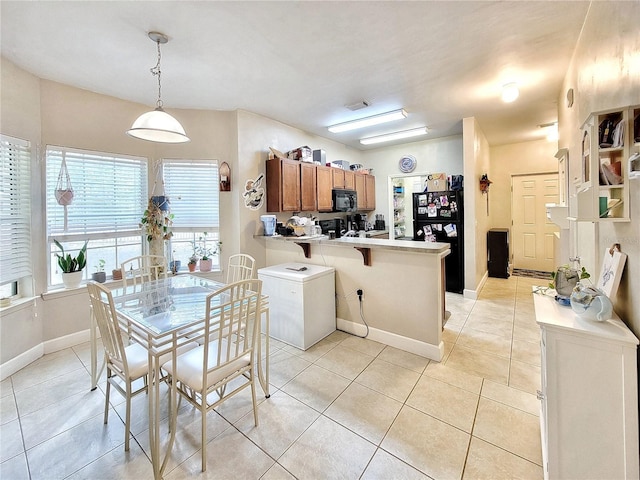 2951 SW 35th Pl Unit 148, Gainesville, FL 32608 - dining space with light tile patterned floors and baseboards