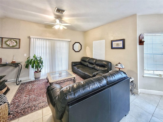 2951 SW 35th Pl Unit 148, Gainesville, FL 32608 - living area featuring light tile patterned floors, ceiling fan, and baseboards