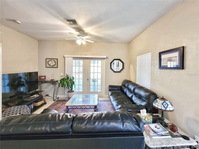 2951 SW 35th Pl Unit 148, Gainesville, FL 32608 - living room with a ceiling fan, french doors, and baseboards