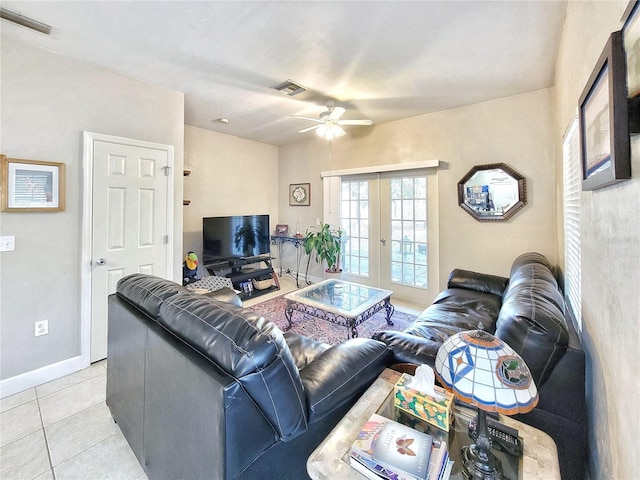 2951 SW 35th Pl Unit 148, Gainesville, FL 32608 - living room featuring french doors, a ceiling fan, light tile patterned floors, and baseboards