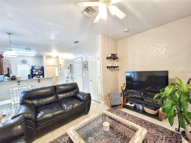 2951 SW 35th Pl Unit 148, Gainesville, FL 32608 - living area with light tile patterned flooring and ceiling fan