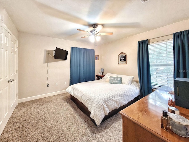 2951 SW 35th Pl Unit 148, Gainesville, FL 32608 - bedroom featuring carpet floors, baseboards, and a ceiling fan