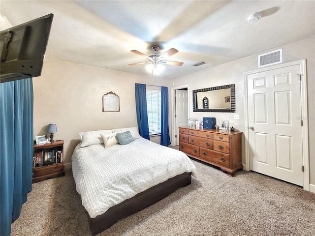 2951 SW 35th Pl Unit 148, Gainesville, FL 32608 - bedroom featuring carpet flooring, ceiling fan, and a closet