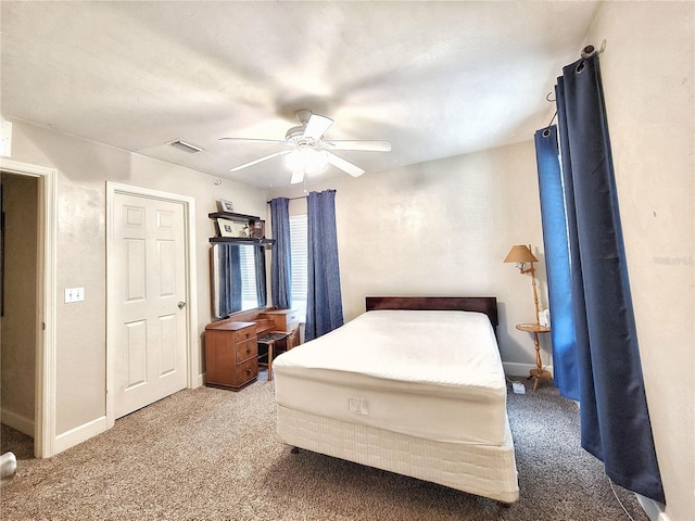 2951 SW 35th Pl Unit 148, Gainesville, FL 32608 - carpeted bedroom featuring baseboards and a ceiling fan