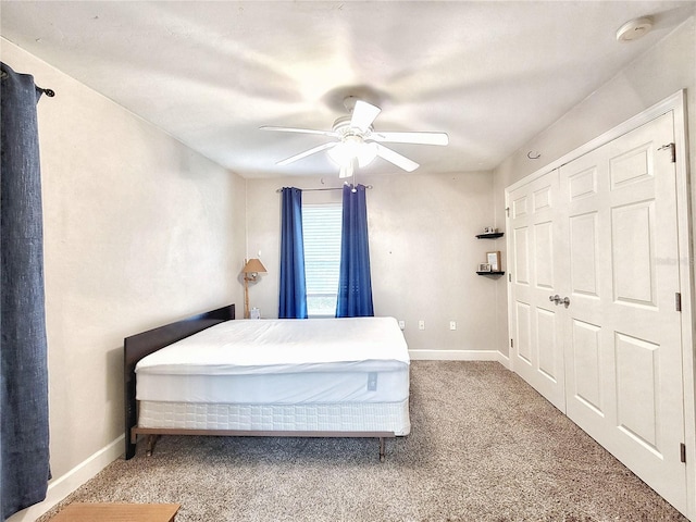 2951 SW 35th Pl Unit 148, Gainesville, FL 32608 - bedroom featuring carpet flooring, baseboards, and a ceiling fan
