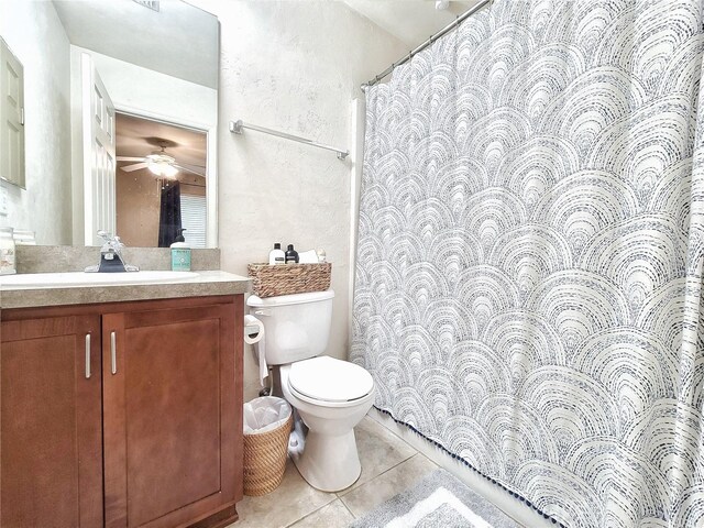 2951 SW 35th Pl Unit 148, Gainesville, FL 32608 - bathroom with toilet, tile patterned floors, vanity, a textured wall, and ceiling fan