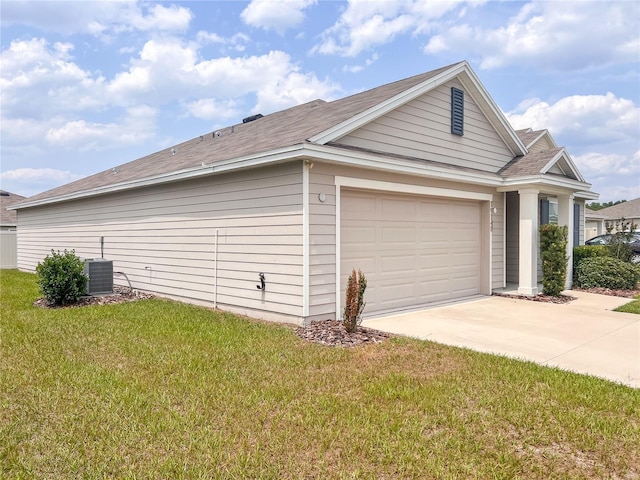 19140 NW 164th Pl, High Springs, FL 32643 - view of home's exterior featuring concrete driveway, a lawn, a garage, a shingled roof, and central air condition unit