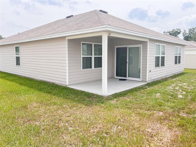19140 NW 164th Pl, High Springs, FL 32643 - rear view of house featuring a patio area and a lawn