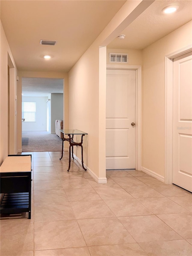 19140 NW 164th Pl, High Springs, FL 32643 - hall with light tile patterned floors, baseboards, and radiator
