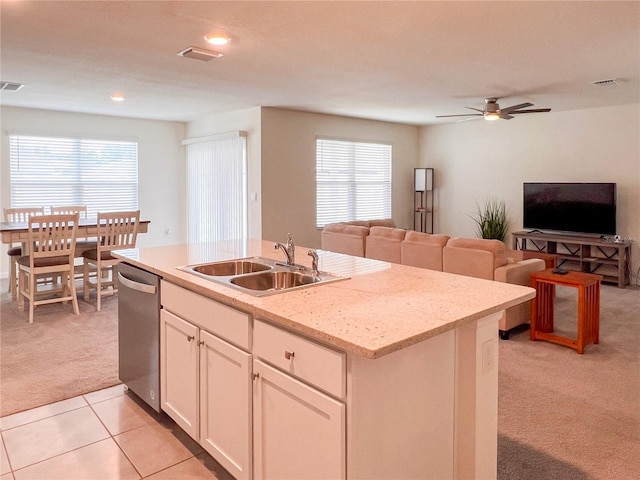 19140 NW 164th Pl, High Springs, FL 32643 - kitchen featuring light colored carpet, a sink, stainless steel dishwasher, open floor plan, and a kitchen island with sink
