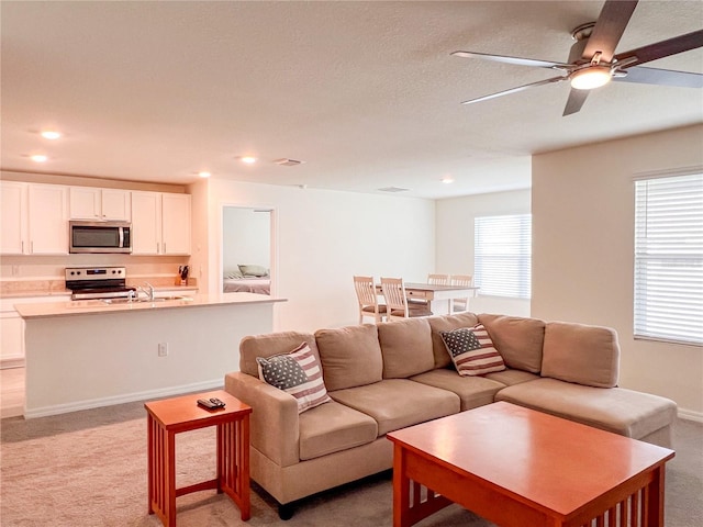 19140 NW 164th Pl, High Springs, FL 32643 - living area featuring light colored carpet, a ceiling fan, and recessed lighting