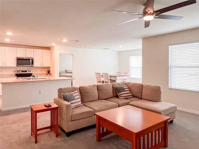 19140 NW 164th Pl, High Springs, FL 32643 - living area with light colored carpet, ceiling fan, and recessed lighting