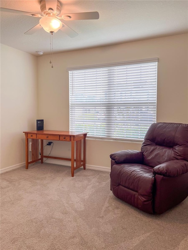 19140 NW 164th Pl, High Springs, FL 32643 - living area with light colored carpet, a ceiling fan, and baseboards