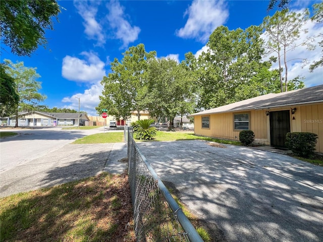 6226 SW 10th Pl, Gainesville, FL 32607 - view of asphalt road with traffic signs