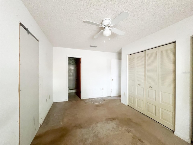 6226 SW 10th Pl, Gainesville, FL 32607 - unfurnished bedroom with a textured ceiling, a ceiling fan, a closet, and carpet flooring