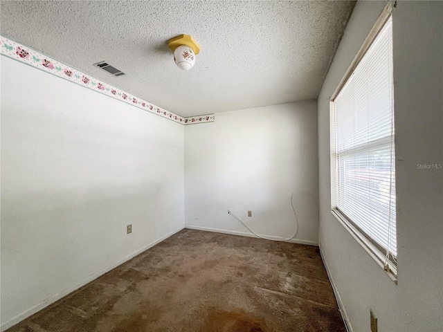 6226 SW 10th Pl, Gainesville, FL 32607 - carpeted spare room with a textured ceiling and baseboards