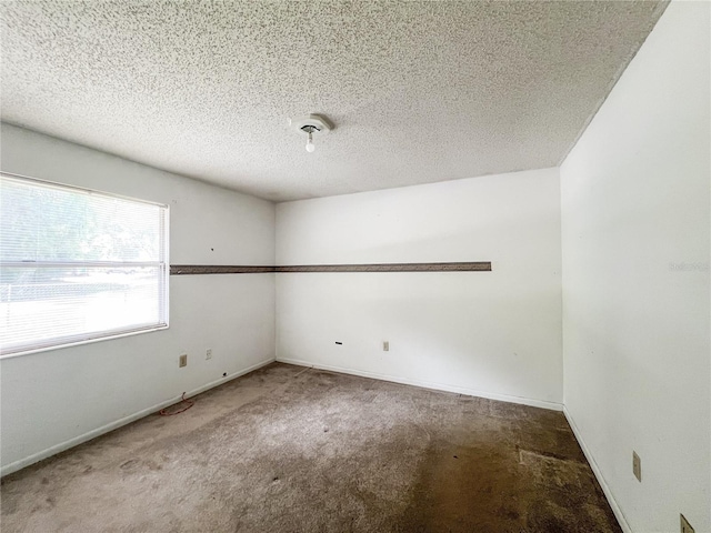 6226 SW 10th Pl, Gainesville, FL 32607 - carpeted empty room featuring a textured ceiling and baseboards