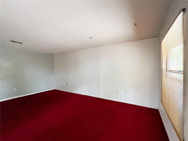 6226 SW 10th Pl, Gainesville, FL 32607 - carpeted empty room featuring a textured ceiling