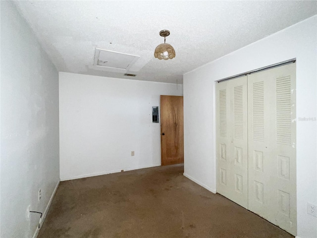 6226 SW 10th Pl, Gainesville, FL 32607 - unfurnished bedroom featuring attic access, a closet, carpet flooring, electric panel, and baseboards