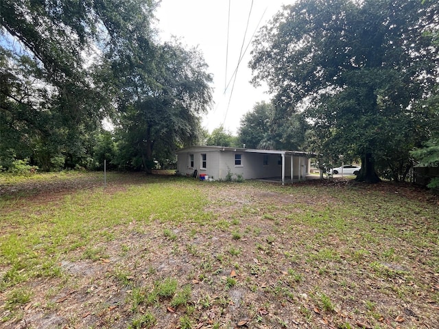 3008 NE 11th Dr, Gainesville, FL 32609 - view of yard featuring an attached carport