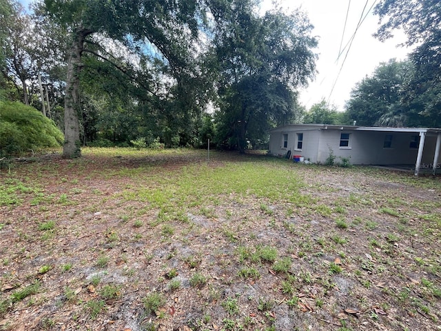 3008 NE 11th Dr, Gainesville, FL 32609 - view of yard featuring a carport