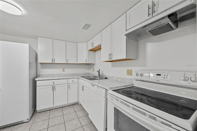 3026 NW 28th Cir, Gainesville, FL 32605 - kitchen featuring white appliances, a sink, light countertops, white cabinets, and range hood