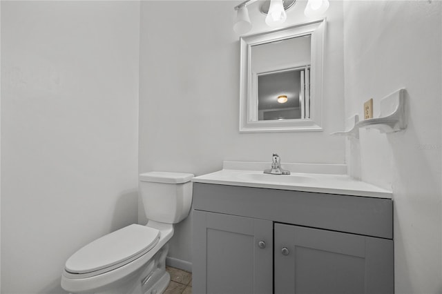 3026 NW 28th Cir, Gainesville, FL 32605 - half bath featuring vanity, toilet, and tile patterned flooring