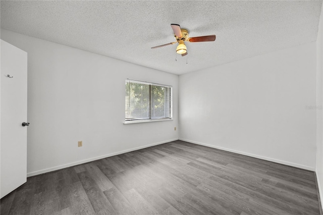 3026 NW 28th Cir, Gainesville, FL 32605 - spare room featuring dark wood-type flooring, a ceiling fan, a textured ceiling, and baseboards