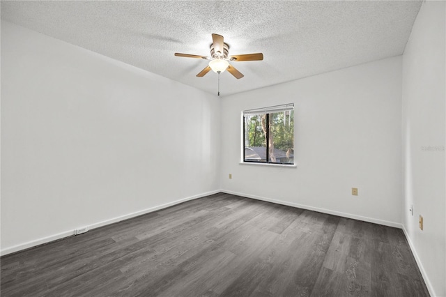 3026 NW 28th Cir, Gainesville, FL 32605 - empty room with dark wood-style floors, a ceiling fan, a textured ceiling, and baseboards