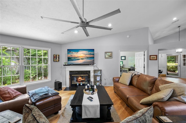 5434 SW 91st Ter, Gainesville, FL 32608 - living area with lofted ceiling, ceiling fan, a high end fireplace, recessed lighting, and light wood-style floors