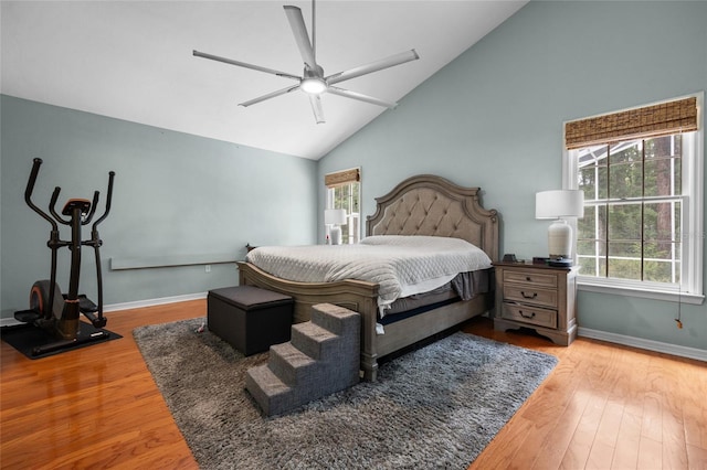5434 SW 91st Ter, Gainesville, FL 32608 - bedroom with wood finished floors, high vaulted ceiling, baseboards, and ceiling fan