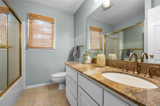 5434 SW 91st Ter, Gainesville, FL 32608 - bathroom with toilet, vanity, healthy amount of natural light, and baseboards