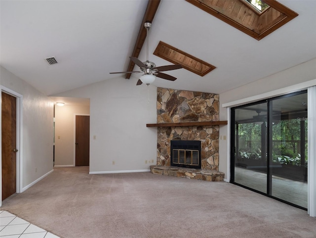 3703 NW 107th Ter, Gainesville, FL 32606 - unfurnished living room featuring a skylight, ceiling fan, carpet, and healthy amount of natural light