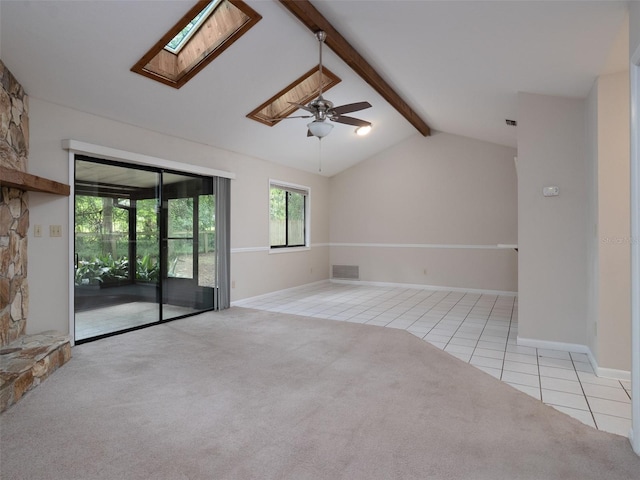 3703 NW 107th Ter, Gainesville, FL 32606 - tiled spare room with a skylight, carpet floors, ceiling fan, and baseboards