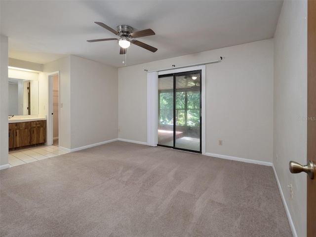 3703 NW 107th Ter, Gainesville, FL 32606 - empty room featuring light carpet, ceiling fan, and baseboards