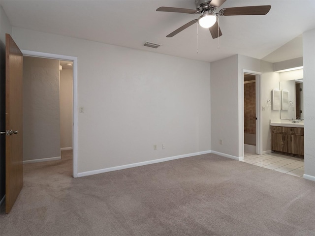 3703 NW 107th Ter, Gainesville, FL 32606 - unfurnished bedroom featuring light colored carpet, ensuite bathroom, baseboards, and ceiling fan