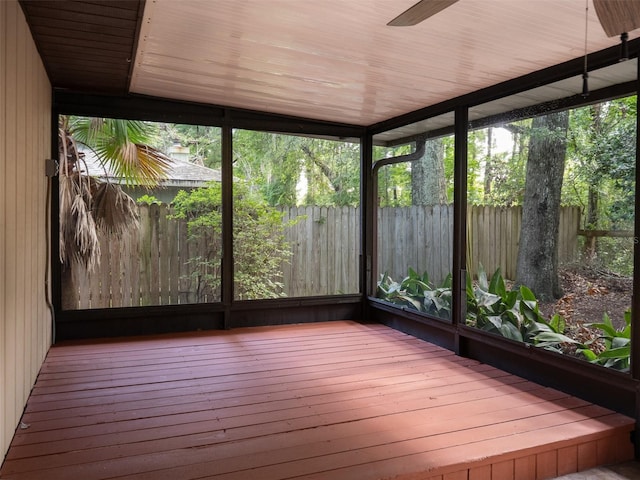 3703 NW 107th Ter, Gainesville, FL 32606 - unfurnished sunroom featuring ceiling fan and wood finished floors