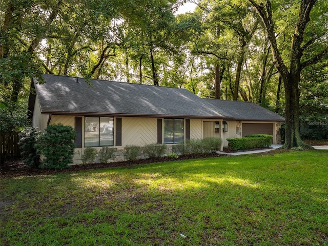 3703 NW 107th Ter, Gainesville, FL 32606 - single story home featuring a front yard and a shingled roof