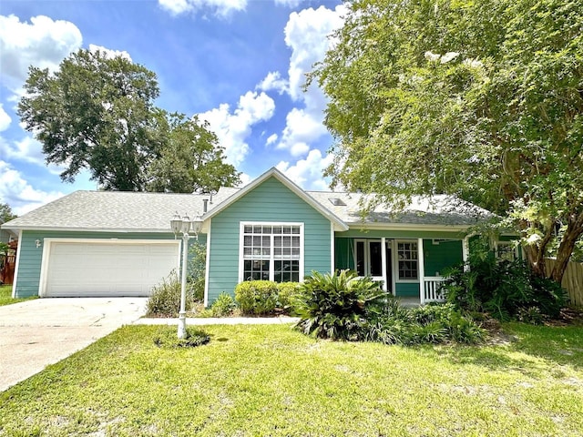 10912 NW 33rd Pl, Gainesville, FL 32606 - single story home with an attached garage, driveway, covered porch, and roof with shingles