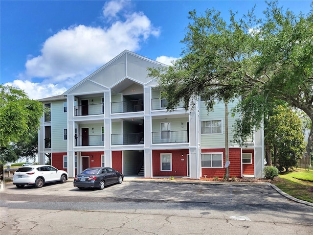 2360 SW Archer Rd Unit 101, Gainesville, FL 32608 - view of building exterior featuring uncovered parking