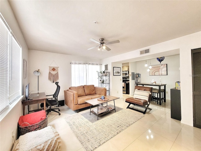 2360 SW Archer Rd Unit 101, Gainesville, FL 32608 - living room with plenty of natural light, a ceiling fan, light tile patterned flooring, and an office area