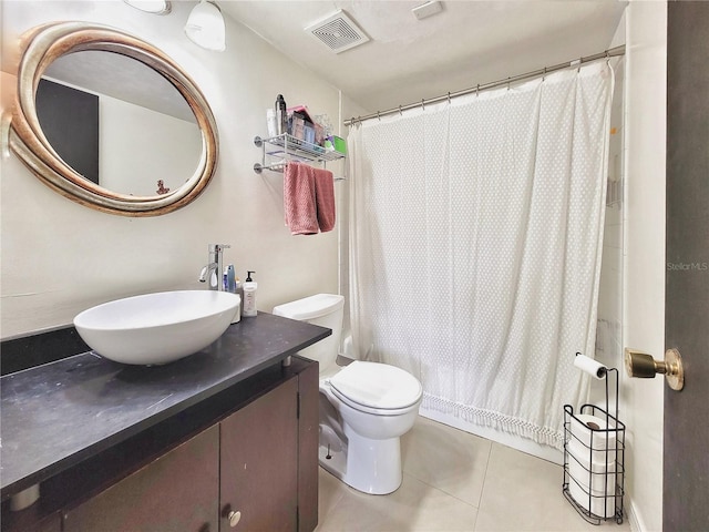 2360 SW Archer Rd Unit 101, Gainesville, FL 32608 - full bath featuring tile patterned flooring, vanity, toilet, and curtained shower