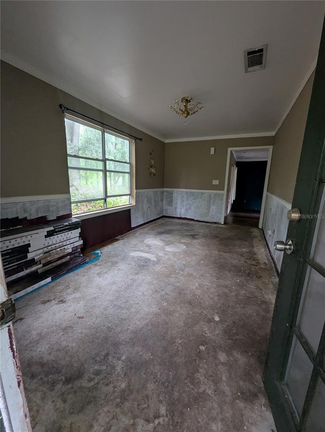 5768 SW 52nd Ter, Lake Butler, FL 32054 - unfurnished living room with wainscoting, crown molding, and concrete flooring