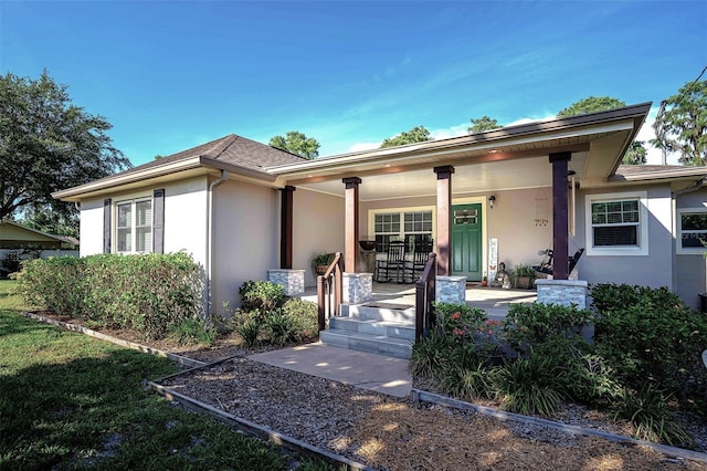 18101 Boy Scout Rd, Odessa, FL 33556 - view of front facade featuring stucco siding and a porch