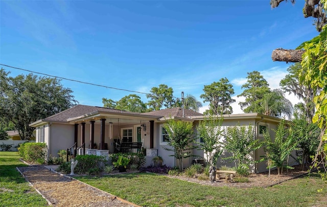 18101 Boy Scout Rd, Odessa, FL 33556 - view of front of home with covered porch, a front lawn, and stucco siding