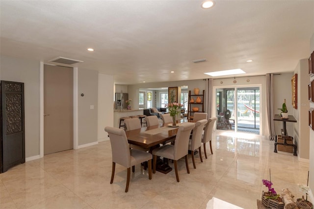 18101 Boy Scout Rd, Odessa, FL 33556 - dining area featuring recessed lighting, plenty of natural light, light marble finish floors, and baseboards